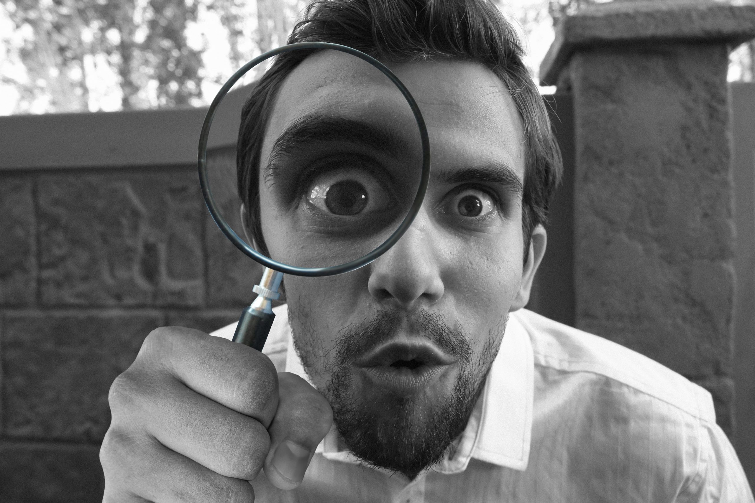 man with magnifying glass